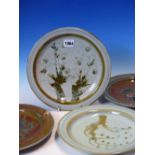 FOUR DAVID EELES, SHEPHERDS WELL POTTERY PLATES PAINTED WITH STYLISED COPPICED TREES ON A GREY