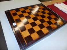 A PARQUETRIED ROSEWOOD FOLDING CHESS AND BACKGAMMON BOARD, THE LATTER WITH ALTERNATING WHITE AND