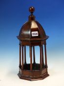 A TABLE BELL HOUSED WITHIN AN OCTAGONAL MAHOGANY CUPOLA. H 37cms.