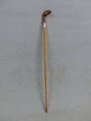 A GOLF CLUB HANDLED WALKING STICK, THE STRIKING FACE INLAID OPPOSITE LEAD WEIGHTING