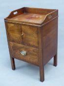 A GEORGIAN MAHOGANY NIGHT TABLE, THE THREE QUARTER GALLERY PIERCED WITH HANDLES ABOVE A CUPBOARD