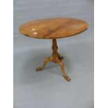 A 19th C. WALNUT TRIPOD TABLE, THE CIRCULAR TOP ON BALUSTER COLUMN AND SHAPED SCROLL FEET. Dia. 72.5