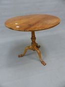 A 19th C. WALNUT TRIPOD TABLE, THE CIRCULAR TOP ON BALUSTER COLUMN AND SHAPED SCROLL FEET. Dia. 72.5