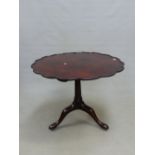 A GEORGIAN AND LATER MAHOGANY BIRDCAGE TABLE, THE WAVY EDGED DISHED CIRCULAR TOP ON GUN BARREL