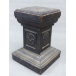 AN EBONISED PINE MASONIC SQUARE SECTIONED COLUMN, THE CENTRAL PANELS CARVED WITH MASONIC SYMBOLS.