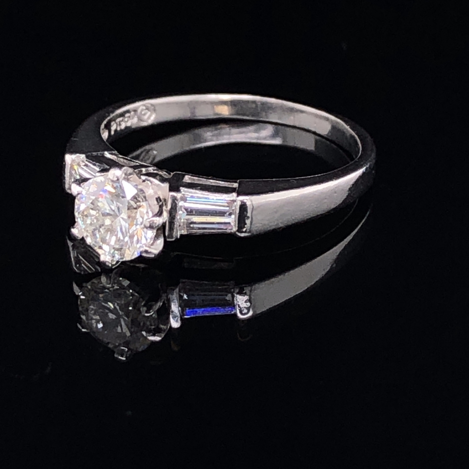 A PLATINUM AND DIAMOND TRILOGY RING. THE CENTRAL DIAMOND APPROX. ESTIMATED WEIGHT 0.70cts, I/SI2/3 - Image 4 of 4