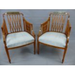 A PAIR OF NEOCLASSICAL STYLE PAINTED SATIN WOOD ARMCHAIRS, THE TOP RAILS PAINTED WITH VILLAGE SCENES