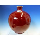 A CHINESE OX BLOOD GLAZED SPHERICAL VASE WITH WOOD STAND, THE RIM OF THE WAISTED NECK WHITE. H 20.