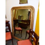 A PAIR OF FRENCH 19th.C. RECTANGULAR MIRRORS WITH ROUNDED TOP CORNERS WITHIN GILT FRAMES INCISED