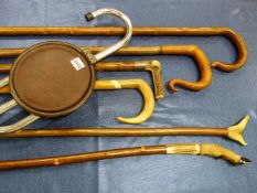 THREE CROOK HANDLED WALKING STICKS, THREE OTHERS WITH ANTLER HANDLES TOGETHER WITH A SHOOTING STICK