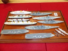 A COLLECTION OF FOURTEEN DINKY WATERLINE SHIPS, TO INCLUDE: FOUR GUNBOATS, TWO AIRCRAFT CARRIERS,