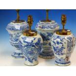 FOUR DELFT BLUE AND WHITE FLORAL PAINTED VASES AS TABLE LAMPS, THE TALLEST VASE. H 24cms.