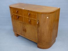 AN ART DECO HEALS OAK SIDEBOARD, THE FOUR DRAWERS CENTRAL TO THE ROUNDED RECTANGULAR FRONT OVER A