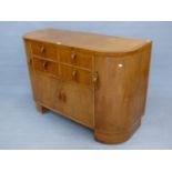 AN ART DECO HEALS OAK SIDEBOARD, THE FOUR DRAWERS CENTRAL TO THE ROUNDED RECTANGULAR FRONT OVER A