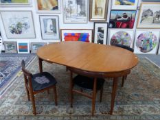 A FREM ROJLE CIRCULAR TEAK DINING TABLE AND FOUR CHAIRS DESIGNED BY HANS OLSEN, EACH WITH LEGS OF