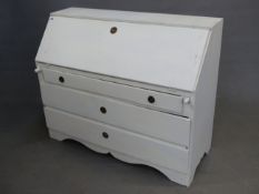 AN EARLY 19th.C. CONTINENTAL PAINTED PINE FALL FRONT BUREAU WITH FITTED INTERIOR OVER THREE DRAWERS.