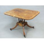 A REGENCY MAHOGANY AND CROSS BANDED SMALL BREAKFAST TABLE, THE TILT TOP OVER FOUR TURNED COLUMNS,