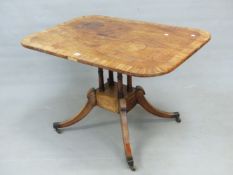 A REGENCY MAHOGANY AND CROSS BANDED SMALL BREAKFAST TABLE, THE TILT TOP OVER FOUR TURNED COLUMNS,