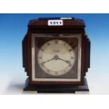 AN ART DECO MAHOGANY AND EBONY CASED MANTEL CLOCK RETAILED BY J HALL & Co. MANCHESTER, THE TIMEPIECE