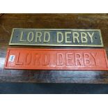 A BRONZE NAME PLATE LORD DERBY TOGETHER WITH THE RED PAINTED WOOD CASTING MAQUETTE. W 48 x 10cms.
