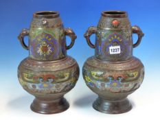 A PAIR OF CHINESE CHAMPLEVE BALUSTER VASES, THE MASK AND TONGUE HANDLES FLANKING PALMETTES BELOW