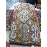 TRIBAL FLAT WEAVE SADDLE BAG MOUNTED AS A CUSHION. LENGTH OVERALL 124cm, TOGETHER WITH ANOTHER