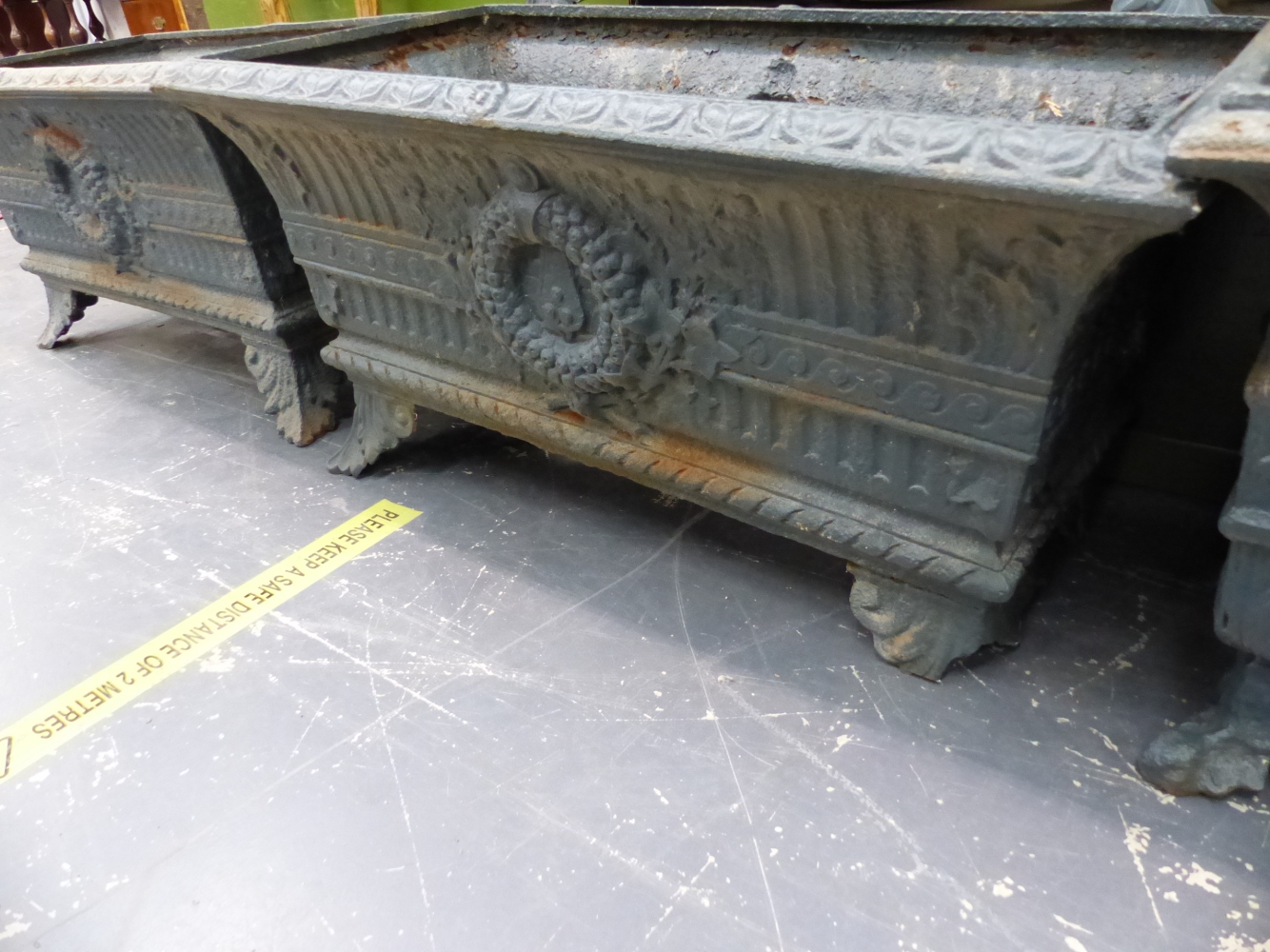 A HARLEQUIN SET OF SIX ANTIQUE IRON PLANTERS, THE RECTANGULAR RIMS OVER FLUTED BANDS AND CENTRAL - Image 5 of 11