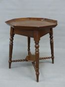A VICTORIAN OAK OCTAGONAL TABLE, THE GALLERY CARVED WITH AYNHO OPPOSITE 1898, THE TURNED LEGS ON