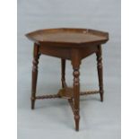 A VICTORIAN OAK OCTAGONAL TABLE, THE GALLERY CARVED WITH AYNHO OPPOSITE 1898, THE TURNED LEGS ON