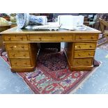 A 19th.C. OAK PEDESTAL DESK, THE LEATHER INSET TOP OVER THREE DRAWERS, THREE FURTHER TO EACH PEDEST