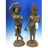 A PAIR OF BRONZE EASTERN FIGURES OF RAMA AND KRISHNA, THE CROWNED FIGURES IN DANCING POSE ON LOTUS