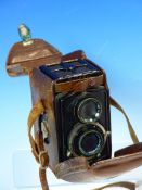 A LEATHER CASED BABY ROLLEIFLEX TWIN LENS CAMERA, No. 149027, POSSIBLY THE 4RF MODEL, WITH 1:2.8 F=