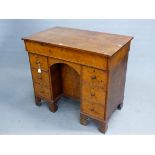 AN EARLY YEW CROSSBANDED WITH OAK PEDESTAL DESK, THE RECTANGULAR LID OPENING ONTO A INSET