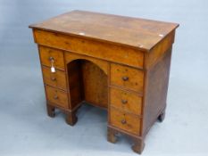 AN EARLY YEW CROSSBANDED WITH OAK PEDESTAL DESK, THE RECTANGULAR LID OPENING ONTO A INSET