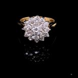 AN 18CT YELLOW GOLD AND TRIPLE TIER DIAMOND CLUSTER RING. SET WITH NINETEEN ROUND BRILLIANT CUT