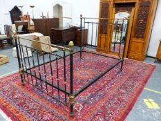 A VICTORIAN HEAL AND SON BRASS MOUNTED IRON DOUBLE BED, THE TUBULAR TOP RAILS EACH ABOVE NINE BLACKE