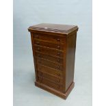 AN ANTIQUE MAHOGANY CHEST OF EIGHT DRAWERS EACH WITH KNOB HANDLES AND ABOVE THE PLINTH FOOT. W 56.5