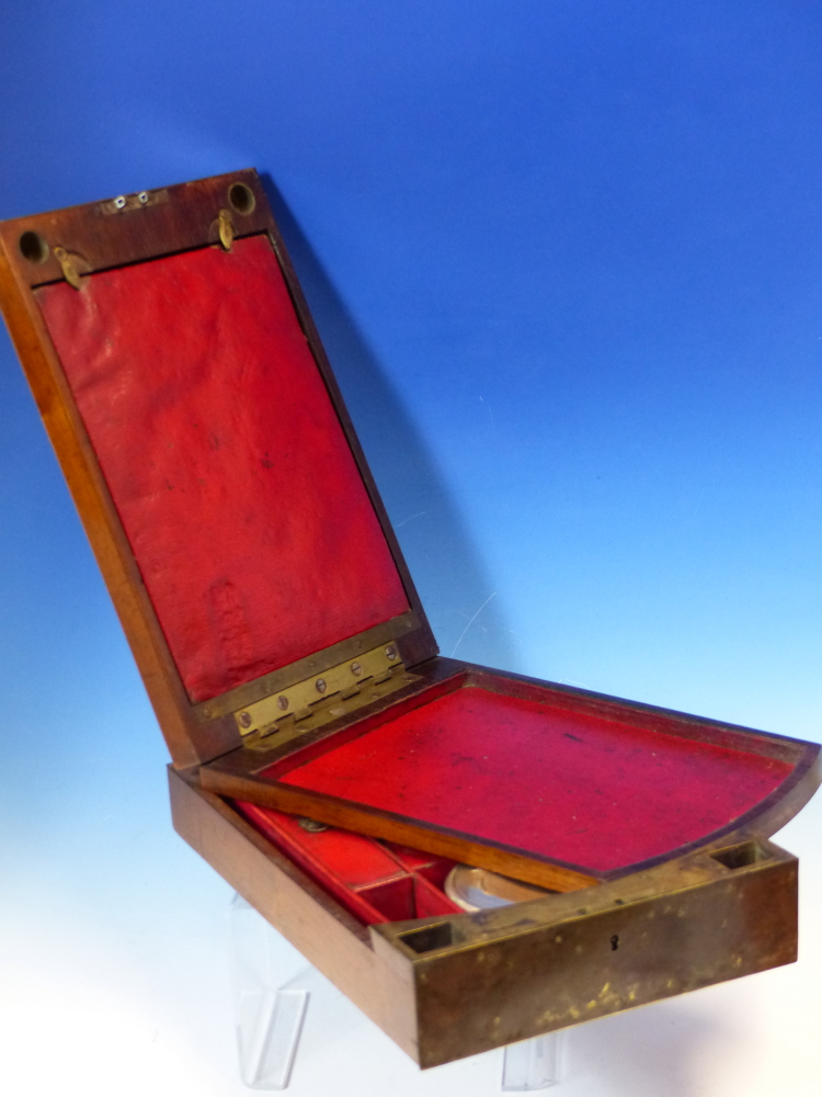 A ROSEWOOD GENTLEMANS CAMPAIGN TRAVEL BOX, THE INSIDE OF THE LID WITH RED SCRIM BACKED MIRROR