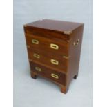 A BRASS BOUND MAHOGANY TWO HANDLED CAMPAIGN STYLE CHEST, THE COFFER TOP OVER TWO CONCEIT AND A REAL