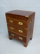 A BRASS BOUND MAHOGANY TWO HANDLED CAMPAIGN STYLE CHEST, THE COFFER TOP OVER TWO CONCEIT AND A REAL