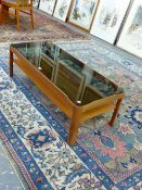 A MYER SMOKED GLASS TOPPED MAHOGANY COFFEE TABLE WITH A TIER BETWEEN LEGS OF QUARTER ROUND