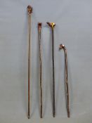 FOUR VARIOUS WALKING CANES WITH HANDLES CARVED AS A HORSE, A FOX, A SQUIRREL AND AN OTTER