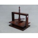 A 19th C. MAHOGANY BOOK PRESS, THE SCREW OF THE TWO HANDLED CLAMP TOPPED BY AN URN FINIAL, THE CLAMP
