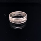 A RARE ENGLISH MEDIEVAL SILVER RING, THE BAND WITH CHASED ROPE TWIST DECORATION, CIRCA 14th C.