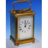 A LEATHER CASED CARRIAGE CLOCK STRIKING AND REPEATING ON A COILED ROD, THE CLOCK. H 15cms.