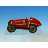 A SCHUCO CLOCK WORK TIN PLATE RED SPORTS CAR, A DIE CAST BENTLEY GT 2002 AND A HAROLD FLORY