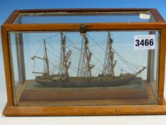 A 1903 GLAZED MAHOGANY CASED MODEL OF THE SHIP POMMERN, THE FOUR MASTS FULLY RIGGED ABOVE THE