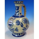 AN 18th/19th C. CENTRAL EUROPEAN BLUE AND WHITE TIN GLAZED EWER PAINTED WITH TULIPS AND OTHER