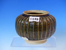 A CHINESE RIBBED GLOBULAR VASE AND WOOD STAND, THE DEEP BROWN HENAN GLAZE WITH PALER STIPPLES