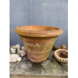 A TERRACOTTA PLANT POT OF TRUNCATED CONICAL SHAPE, THE RIM. Dia. 68 x H 50cms.